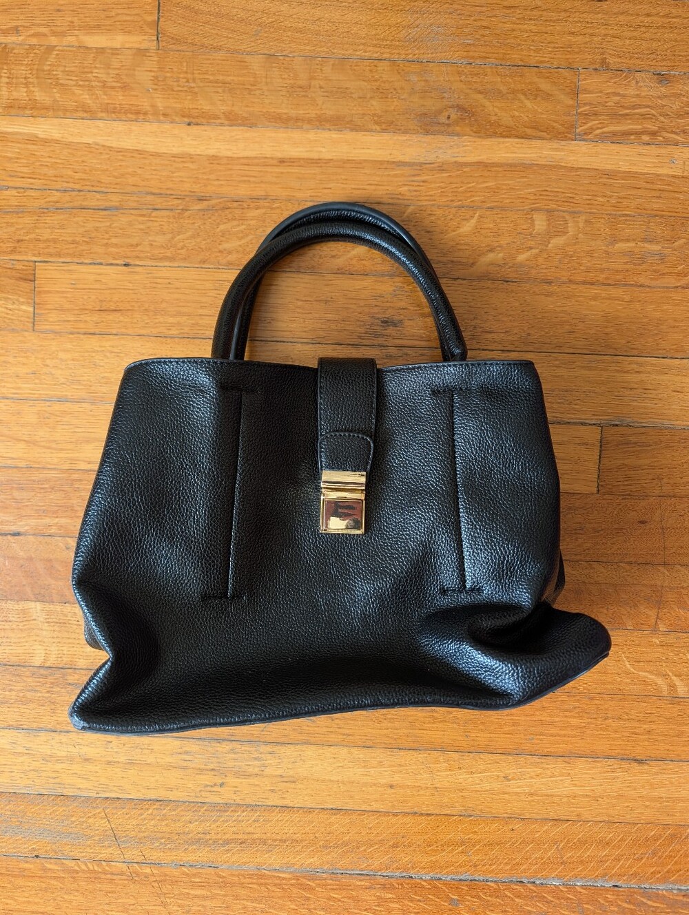 Black Leather Top-Handle Tote with Gold Latch Closure